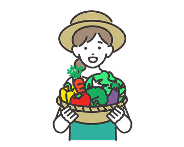 カゴに入った野菜を持つ女性